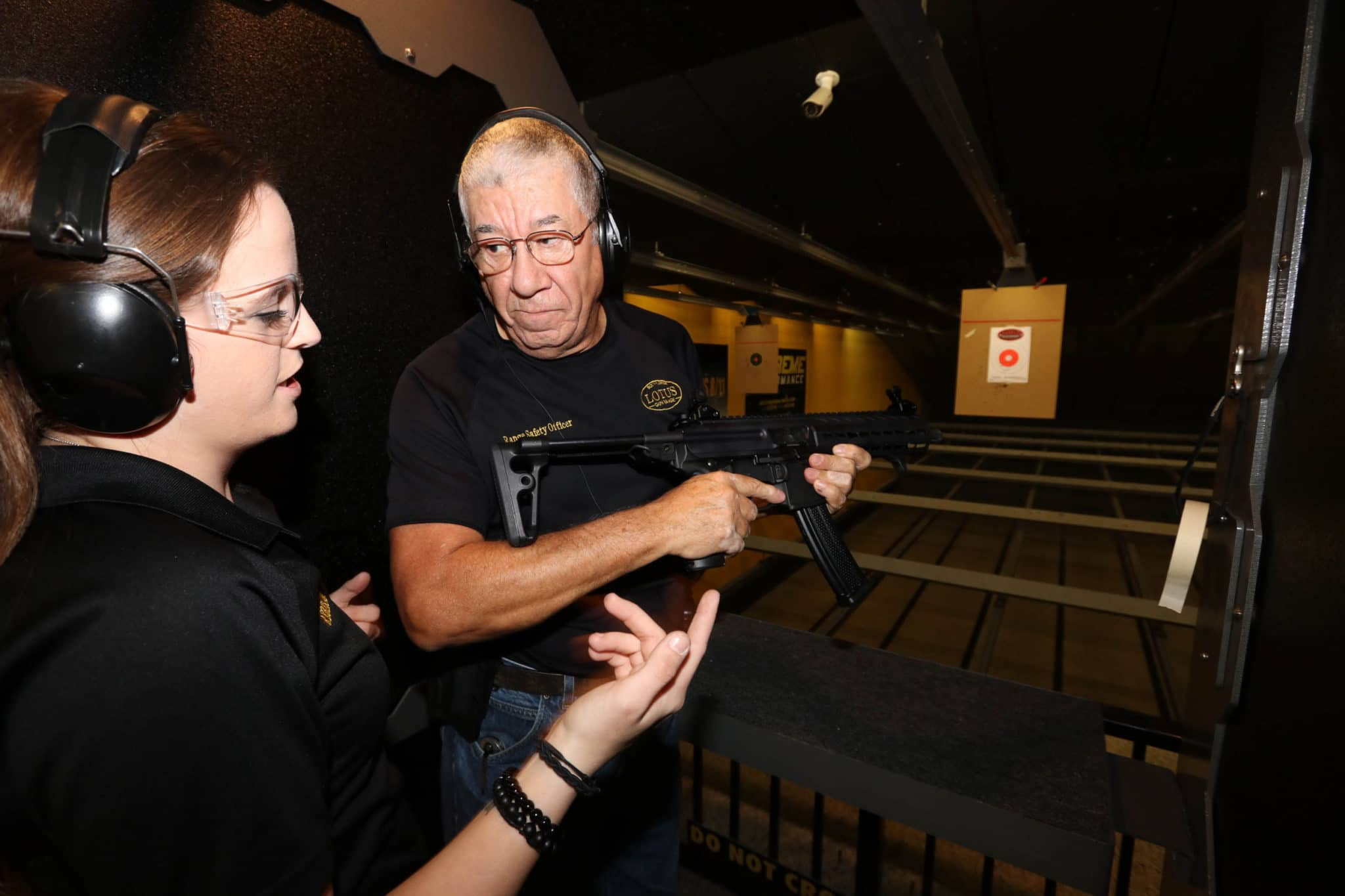 Firearms instructor and student at The Alamo of Jensen Beach training range